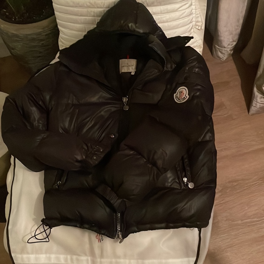 This a size 2 mens black Moncler coat medium size in excellent used condition
